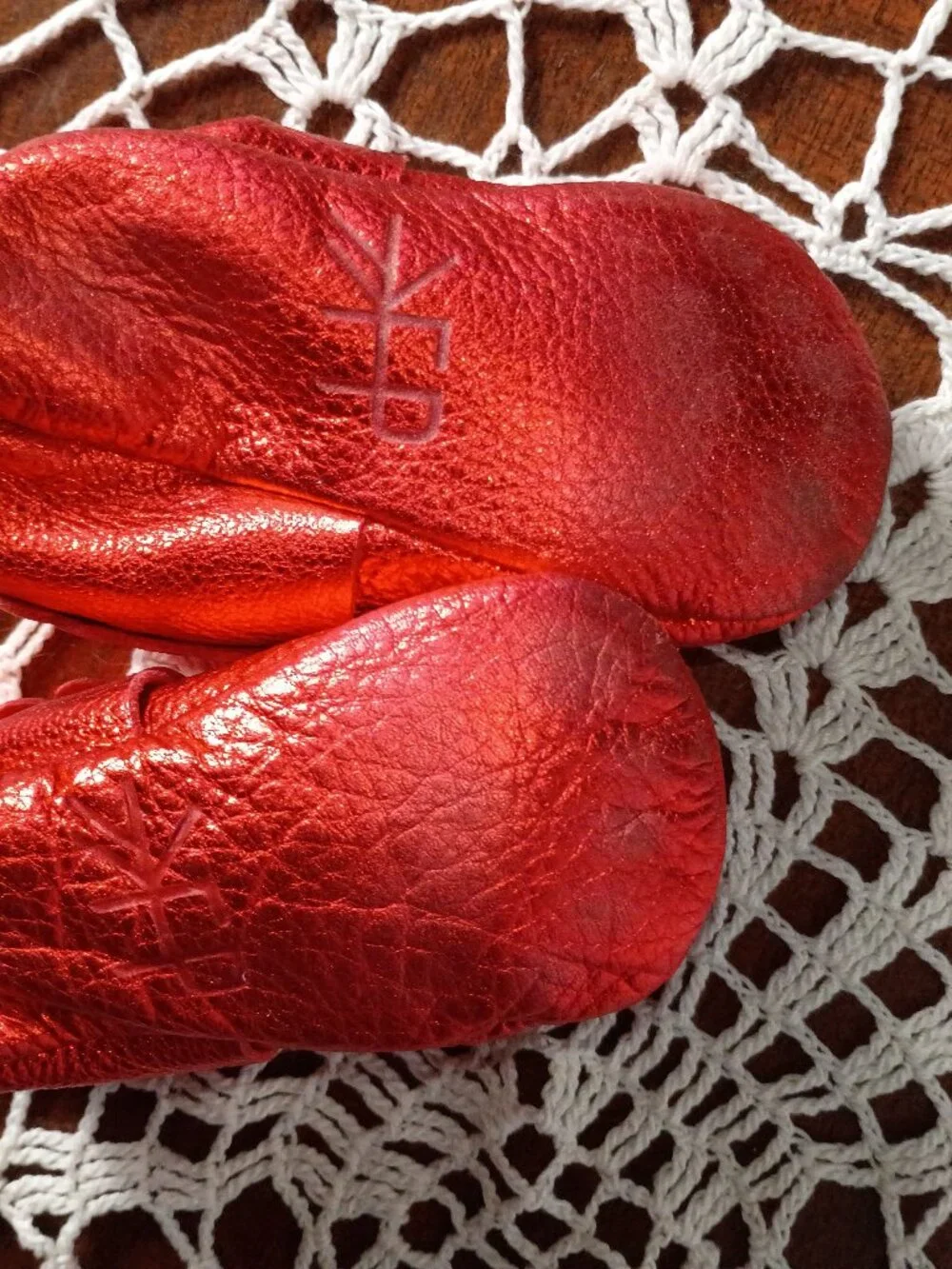 Freshly picked ruby red baby mocassins with bow and ruffles size 5